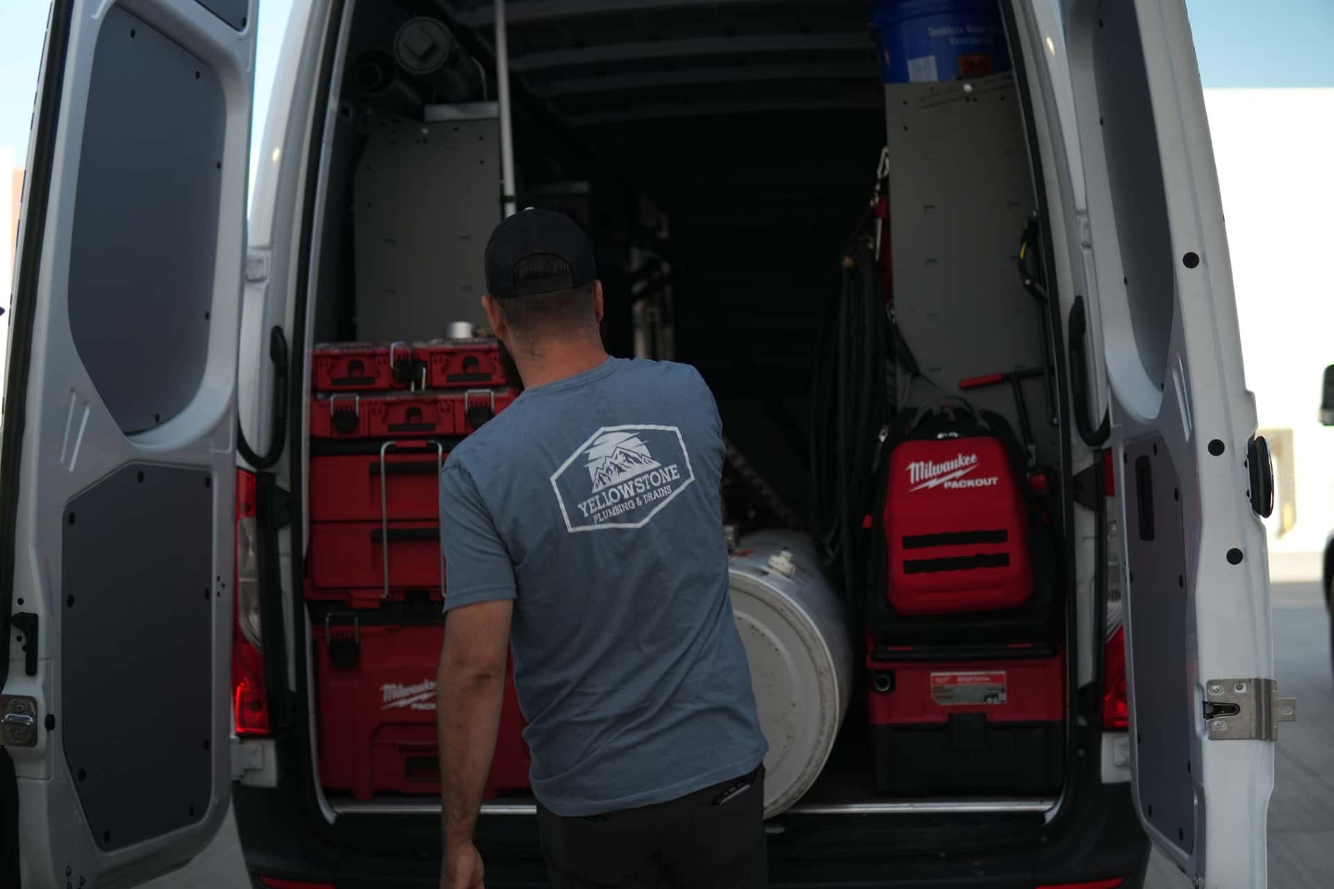 Organized plumbing tools inside a Yellowstone Plumbing service van